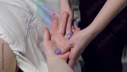 massage of the hand with fingers
