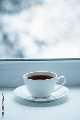 Cup tea on the background of the winter landscape.