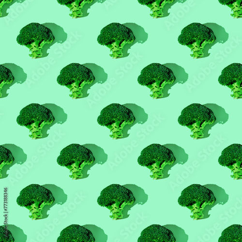 Seamless plant pattern with broccoli on green background. background, healthy food, vegetarianism
