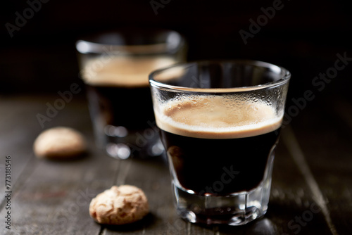 Two Glasses Of Coffee on dark wooden background. Close up. 