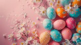 A bunch of colorful easter eggs on a pink surface