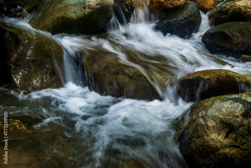 Long exposure image of stream water with rocks