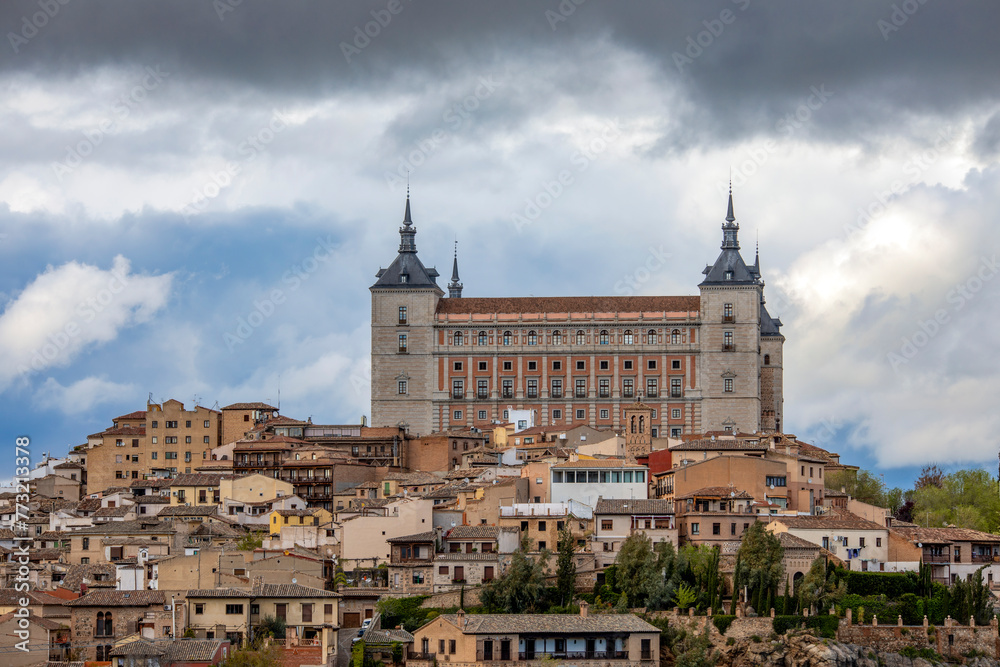 Imposing view of the Alcazar of Toledo, Castilla la Mancha, Spain, a world heritage site, high above the city on a cloudy day