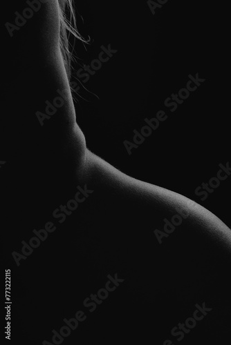 Black and white silhouette of a woman's back.