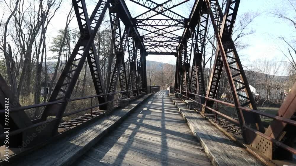 railway trestle bridge over wallkill river valley (springtown bridge in new paltz, new york) iron metal former railroad converted to rail trail and pedestrian path in hudson valley railway trestle bridge over wallkill river valley (springtown bridge in new paltz, new york) iron metal former railroad converted to rail trail and pedestrian path in hudson valley