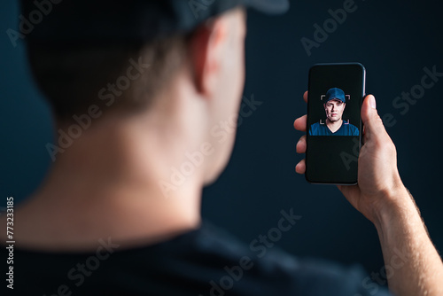 Deep fake and face recognition. Deepfake or identity scan with phone. Facial id verification with cellphone. Identification technology in smartphone. Man using AI, biometric and mobile tech. photo