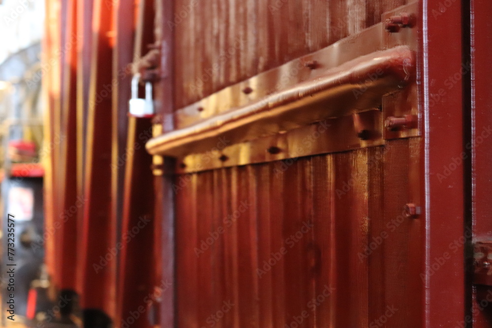 Railway wooden train carriage. An antique freight car made of wood close-up.