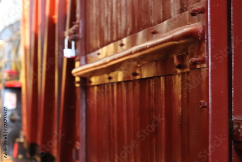Railway wooden train carriage. An antique freight car made of wood close-up. © Marat