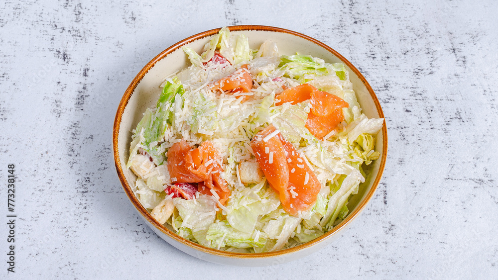 Salmon Caesar salad bowl isolated top view Salmon Caesar salad bowl isolated top view