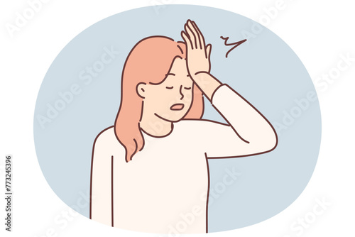Woman makes gesture with facepalm putting palm to forehead, having learned about mistake made