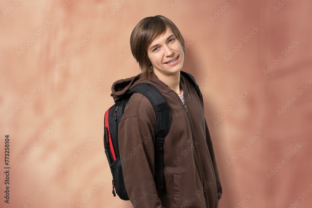 Portrait of a young happy student with backpack