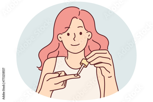 Woman holds pipette with cosmetic product to treat face with regenerating hyaluronic acid