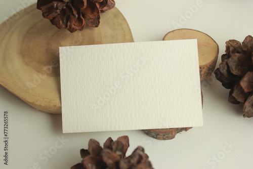 Blank paper for mockup business card decoration on a wooden background photo