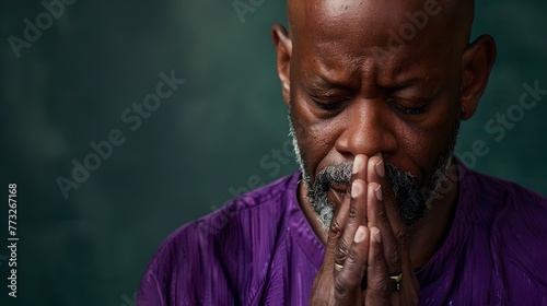 Serene Man in Deep Thought or Prayer, Wearing Purple Shirt. Emotional Portrait, Contemplative Mood. Perfect for Dramatic Projects. AI