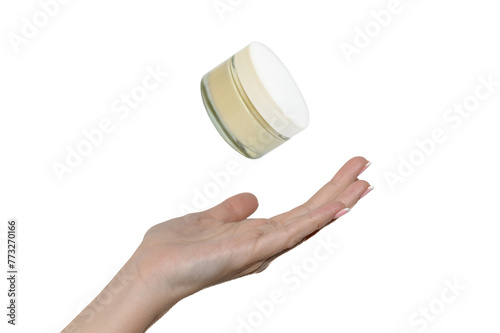 Hand of a young girl on a white background. White cosmetic cream.