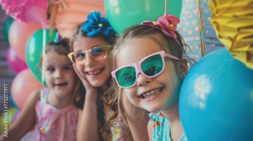 A birthday party with a photo booth for guests to take fun pictures. 