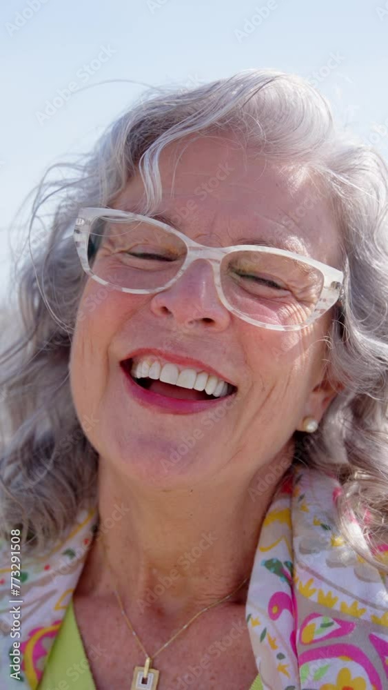Portrait of happy mature woman laughing while looking at camera. Portrait of happy mature woman laughing while looking at camera.