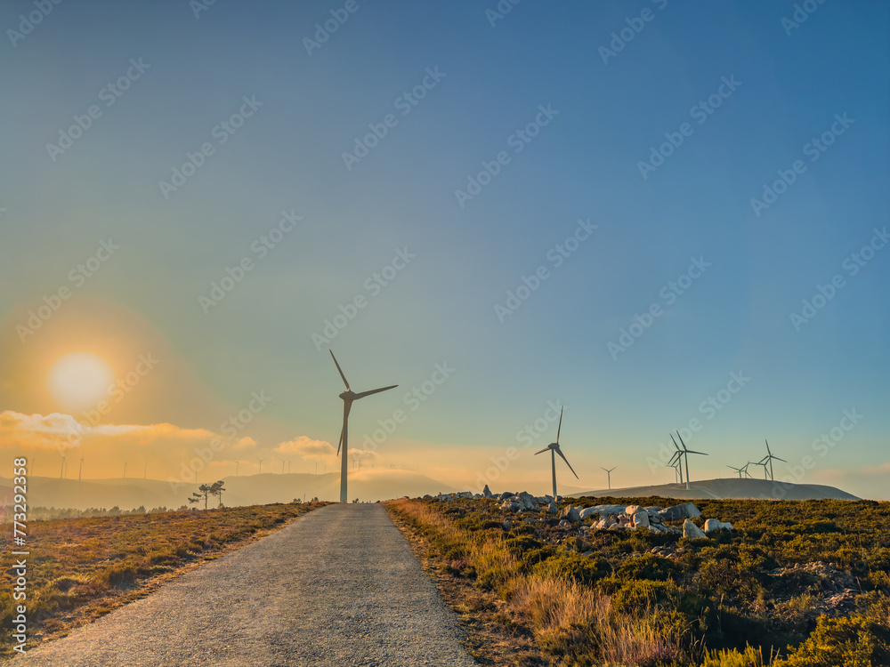 Lansdcape with wind turbines. Renewable energy on the middle of Serra da Arada Arouca Geopark, in center of Portugal - obrazy, fototapety, plakaty 