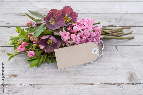 Greeting card with pink hyacinths, Christmas roses and copy space