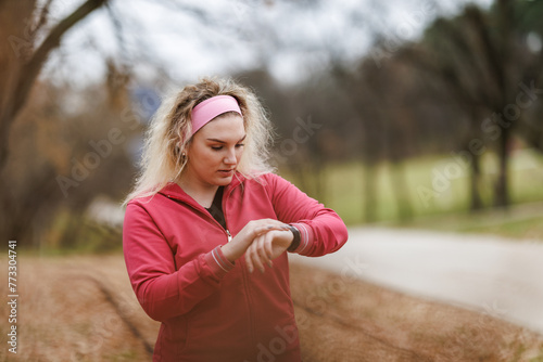Woman Checking Smartwatch During Outdoor Training