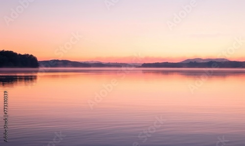 Bright sunrise over the lake  clouds reflected in water surface