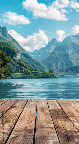 Table en bois, arrière-plan sur fond flou de lac et de montagnes, image avec espace pour texte. © David Giraud
