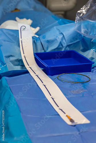 Stent and catheter for implantation into blood vessels with an empty and filled balloon. Metal stent for implantation and supporting blood circulation into blood vessels. High resolution photography.