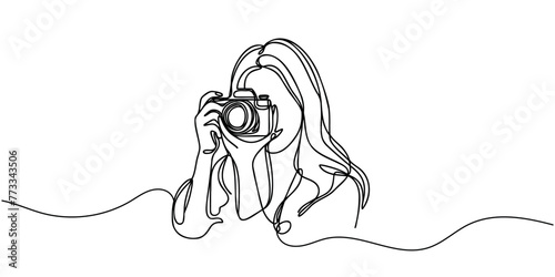 The girl takes pictures with the camera. One line is continuous. Vector illustration