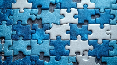 A tight shot of a blue and white jigsaw puzzle piece, displaying an empty center where a section should be