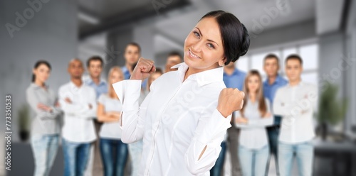 Excited overjoyed business people team together in office