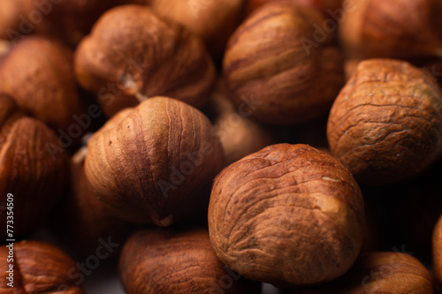 Close-up of Hulled whole cobalt or hazelnut seeds of Corylus avellana. Macro photo of food, close up from above