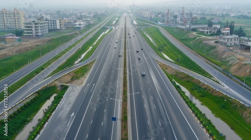 Aerial view of highway and overpass in city on a cloudy day