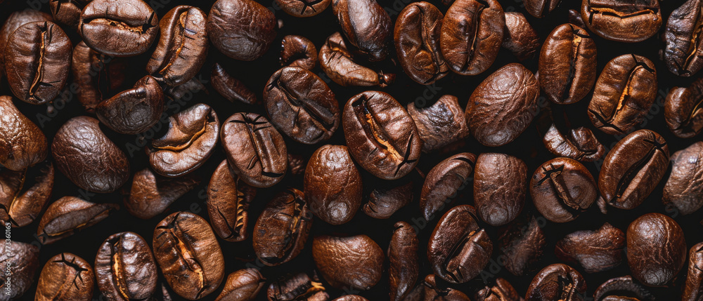 Obraz premium Roasted coffee beans texture for background. Roasted coffee beans for background or design, top view.