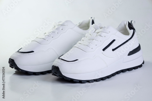 White sports sneakers on a white background