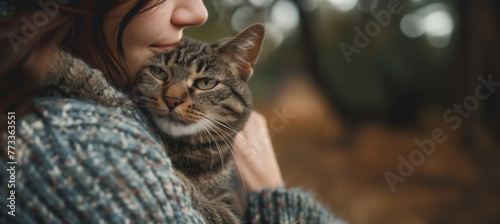 woman hugs her cat with copy space