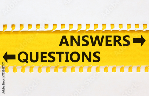 Questions and answers symbol. Concept word Questions Answers on beautiful yellow paper. Beautiful white paper background. Business questions and answers concept. Copy space.