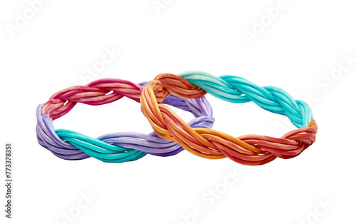 Two bracelets of different colors sitting side by side on a surface
