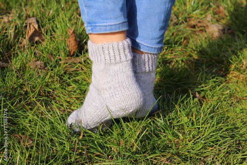 A person's feet in the grass