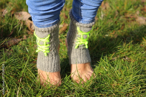 A person's feet in the grass