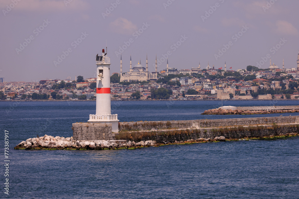 Embankment and sea, beach and buildings of a southern city, public place in Turkey, on a summer sunny day Embankment and sea, beach and buildings of a southern city, public place in Turkey, on a summer sunny day