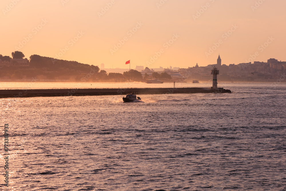 Embankment and sea at sunset, beach and buildings of a southern city, public place in Turkey Embankment and sea at sunset, beach and buildings of a southern city, public place in Turkey