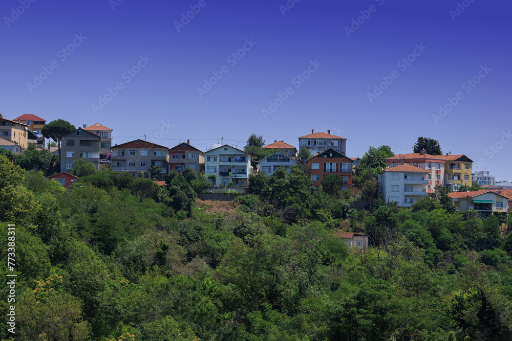 Beautiful houses and city streets of the southern city with green plants, public place in Turkey, on a summer sunny day Beautiful houses and city streets of the southern city with green plants, public place in Turkey, on a summer sunny day