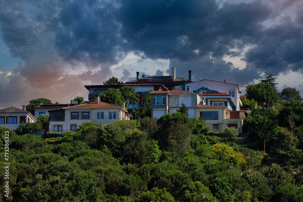 Beautiful houses and city streets of the southern city with green plants, public place in Turkey, on a summer sunny day Beautiful houses and city streets of the southern city with green plants, public place in Turkey, on a summer sunny day