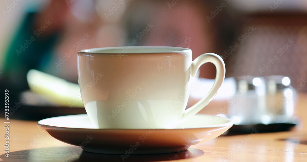 Obraz premium Morning cup of coffee with steam, warm drink