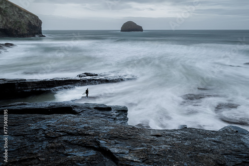 Surfer Entering in the Water from Rocks