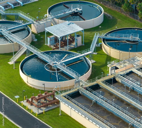 Aerial view of water treatment factory at city wastewater cleaning facility. Purification process of removing undesirable chemicals, suspended solids and gases from contaminated liquid © bilanol