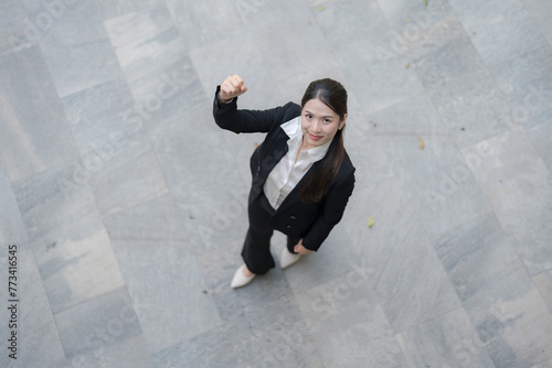 Confident businesswoman giving thumbs down