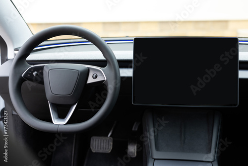 Empty cockpit electric vehicle, Head Up Display and digital speedometer. Steering wheel of electric vehicle, interior, cockpit, electric buttons. Autonomous car. Driverless car. Self-driving vehicle © uflypro