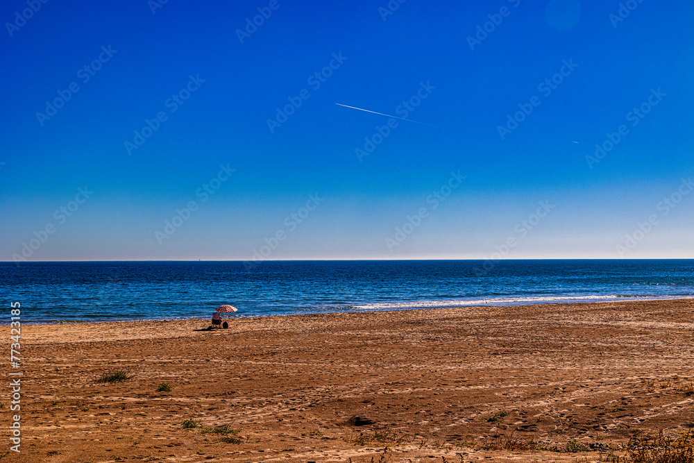 empty beach with one lounger holiday landscape