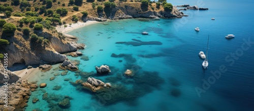 Aerial view of turquoise water bay with luxury yachts and sailboats